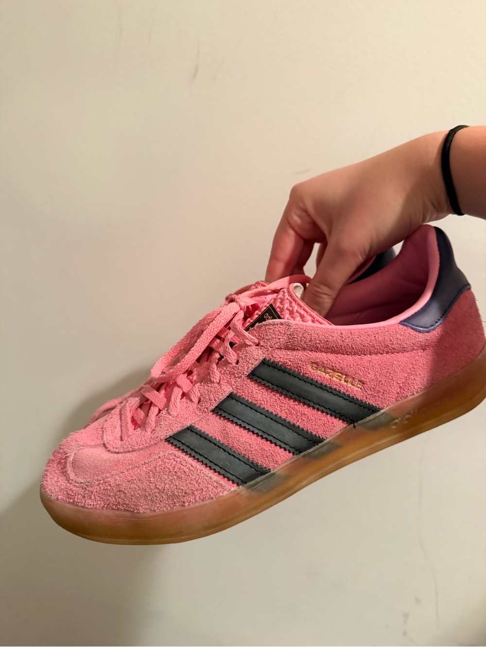 adidas pink suede sneakers with black stripes and gum sole